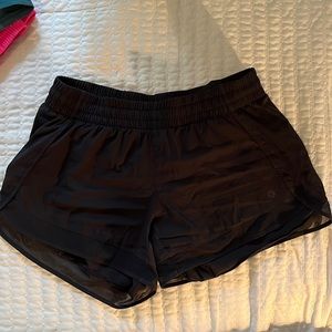 Athleta black shorts with zippered rear pocket- size S
